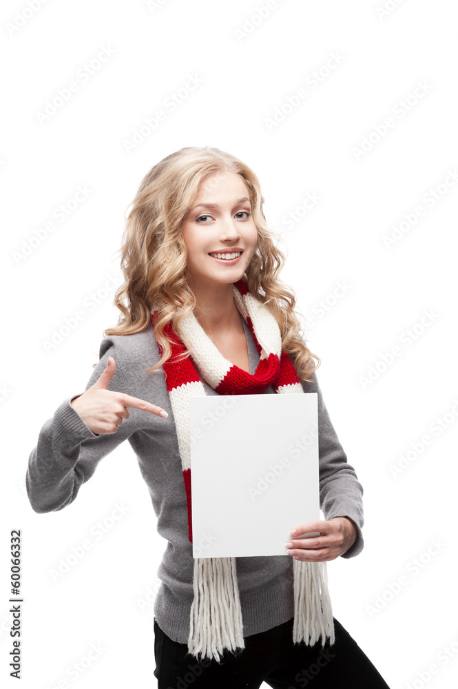 young smiling woman pointing at sign young smiling woman pointing at sign