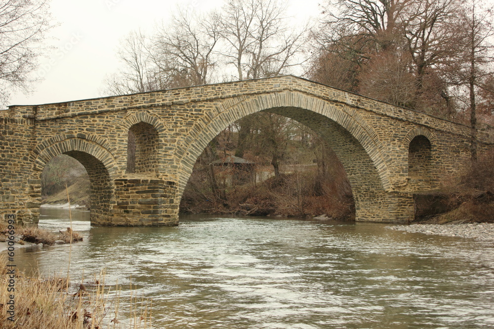Zakas  arch stone ottoman Bridge and river near Grevena in Greece