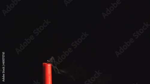 Candle dies out in the wind, closeup