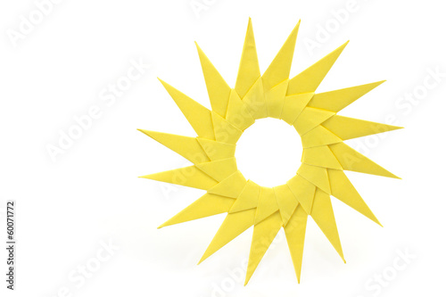Origami  yellow paper sun isolated on white