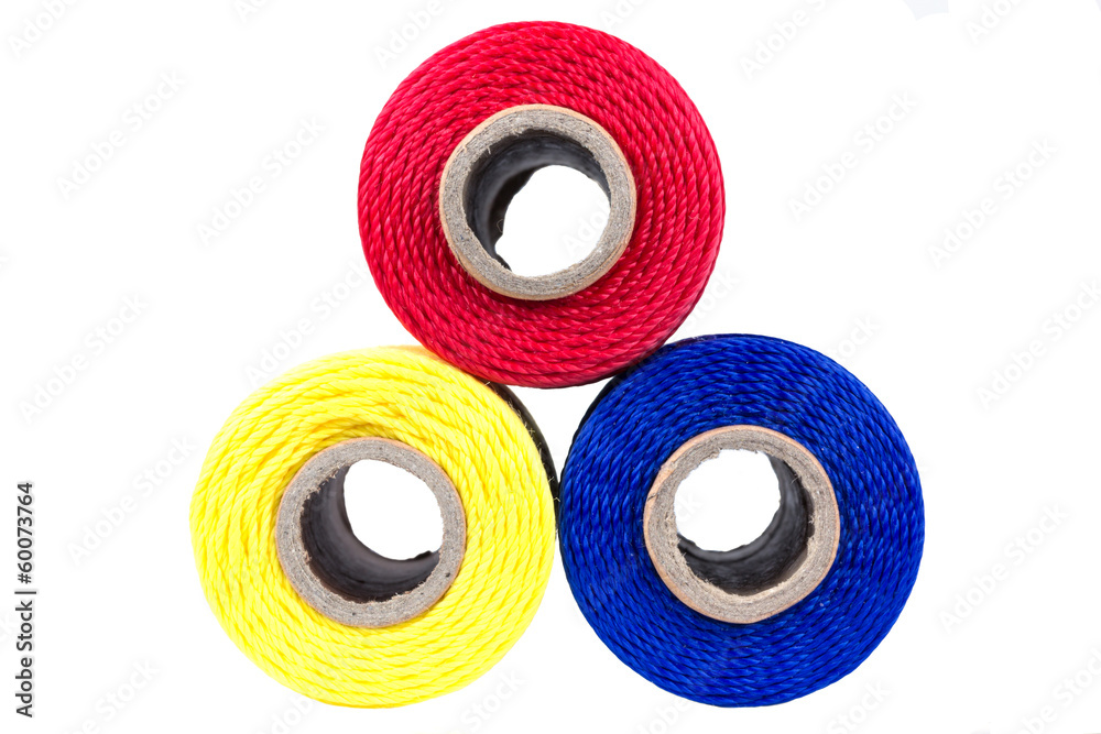 three spools of thread isolated three spools of thread isolated