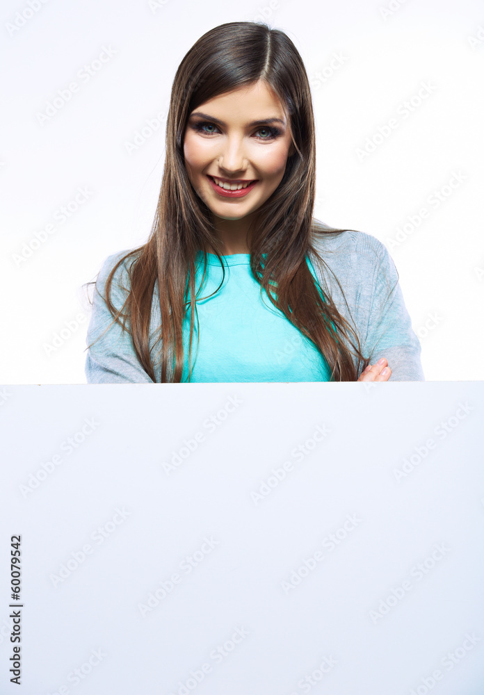 Teenager girl hold white blank paper. Young smiling woman show Teenager girl hold white blank paper. Young smiling woman show