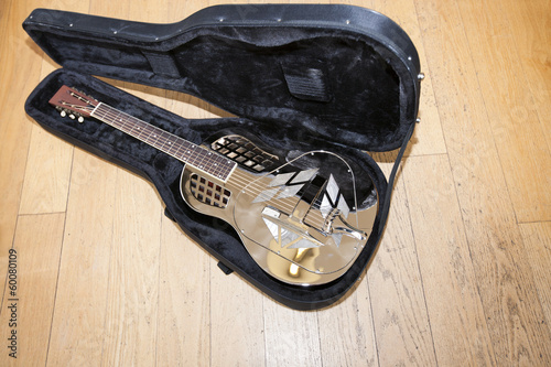 Obraz na plátně Full view of resonator guitar in carry case