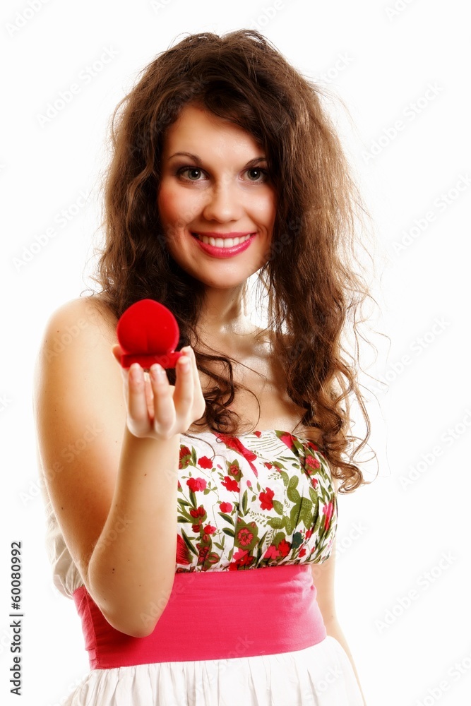 woman holding a present with engagement ring woman holding a present with engagement ring