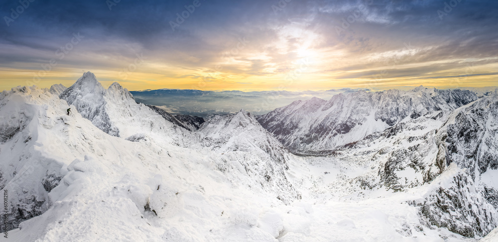 Panoramic view of winter mountains at sunset Panoramic view of winter mountains at sunset