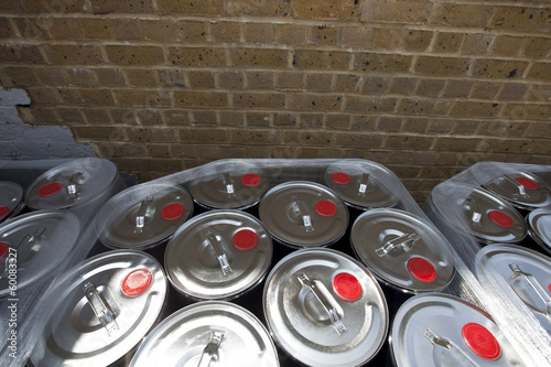 Φωτογραφία Wrapped tins against brick wall at warehouse