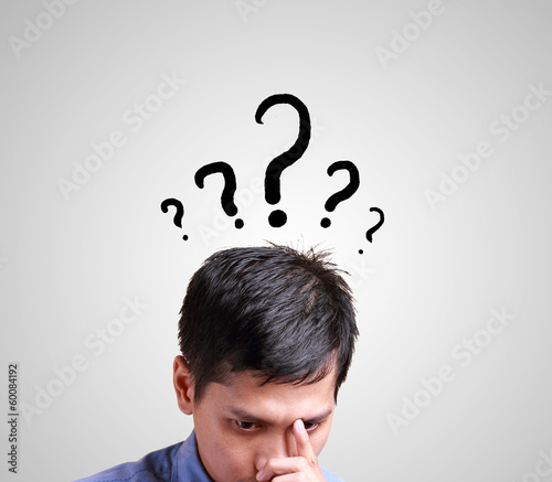 Business man thinking with question sign