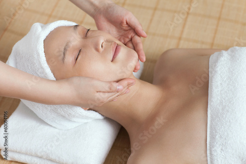 .A young woman enjoy massage.
