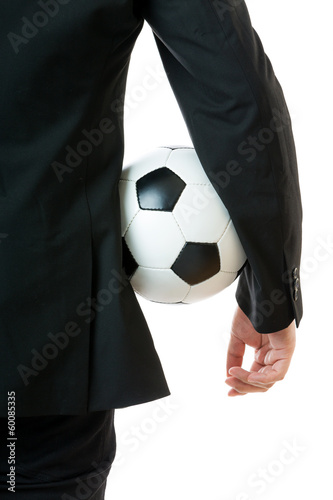 Fototapeta Naklejka Na Ścianę i Meble -  Businessman holding soccer ball