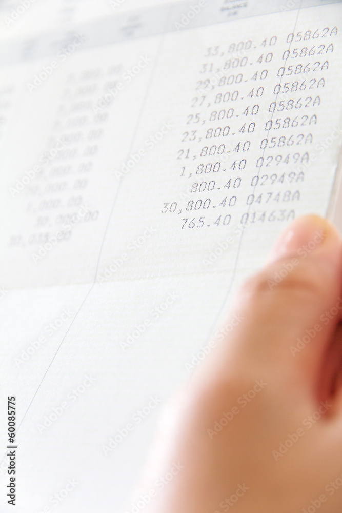 Obraz premium hand holding bank account book,financial concept
