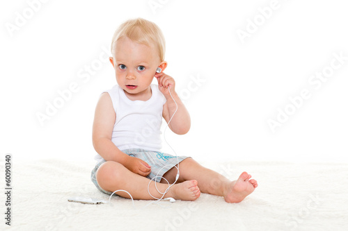 Small baby listening to music. © Dmitriy Melnikov