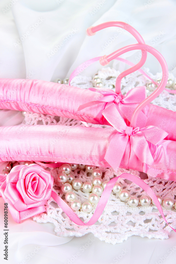 Beautiful hanger on fabric background Beautiful hanger on fabric background