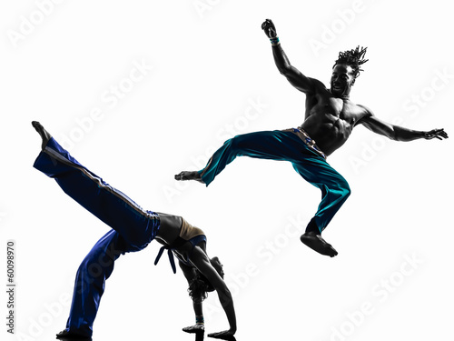 Fototapeta Naklejka Na Ścianę i Meble -  couple capoeira dancers dancing   silhouette