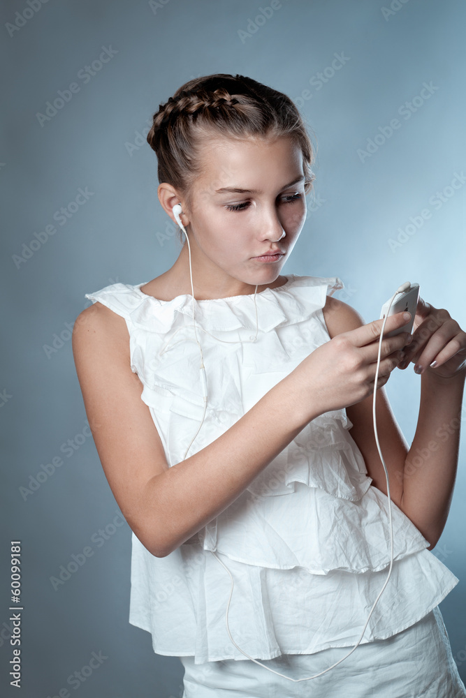 Beautiful girl and smartphone, portrait on gray background Beautiful girl and smartphone, portrait on gray background