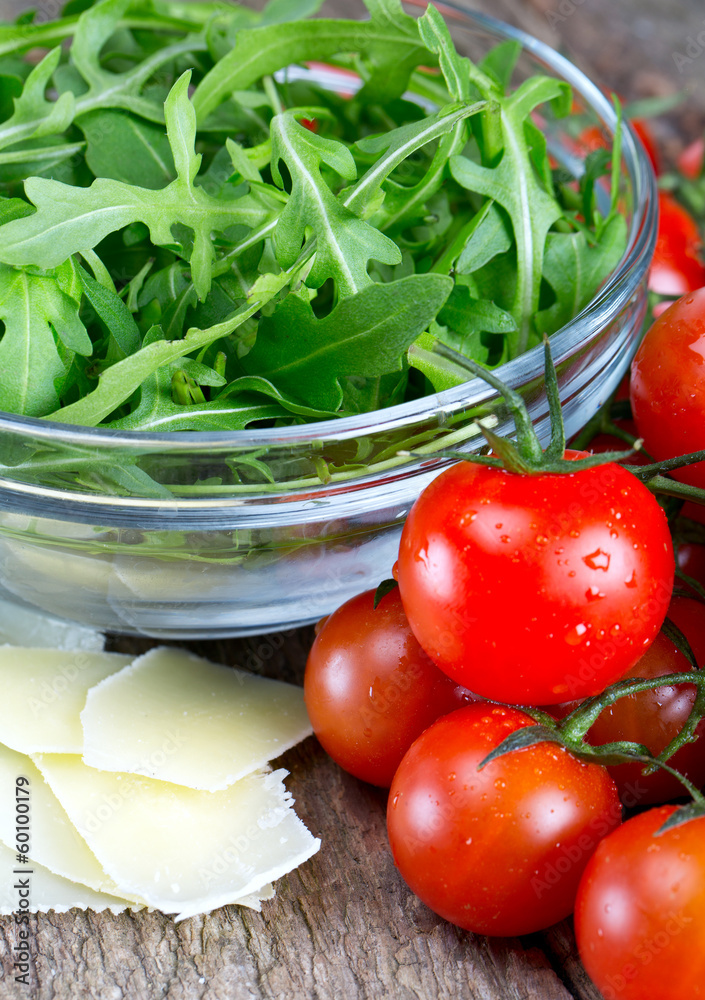 fresh salad from rucola, cherry tomatoes and parmesan cheese fresh salad from rucola, cherry tomatoes and parmesan cheese