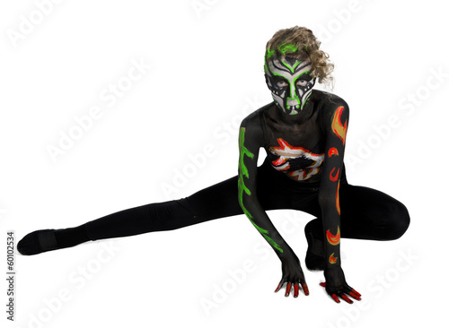 The girl in an unusual dance image, painted in dark colors