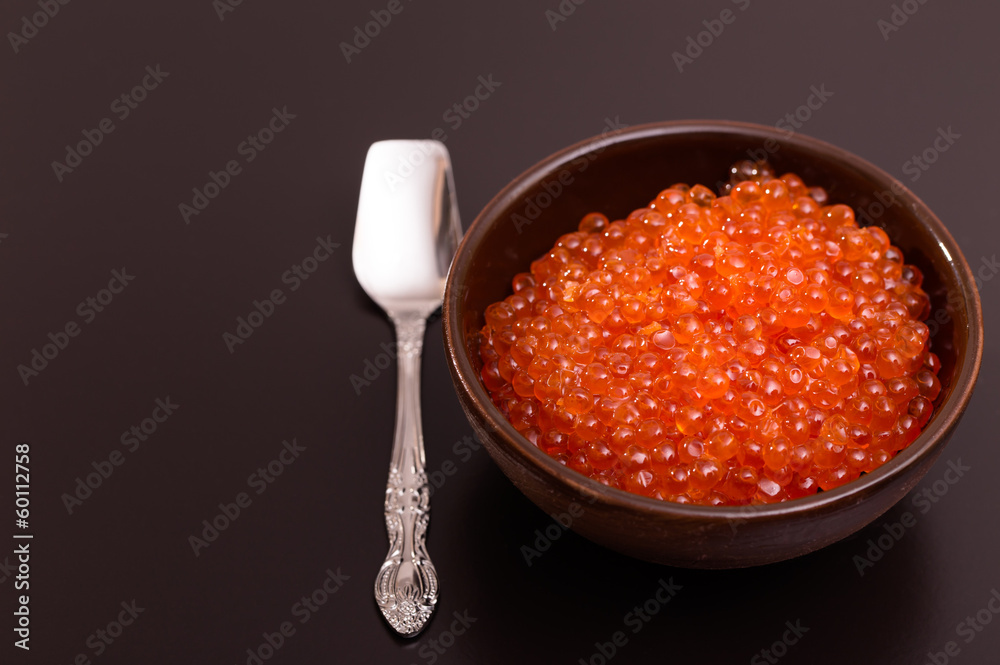 Bowl of red caviar and spoon Bowl of red caviar and spoon