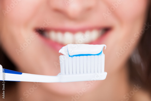 Fototapeta Naklejka Na Ścianę i Meble -  Woman Brushing Teeth