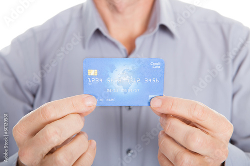 Mature Businessman Showing Credit Card