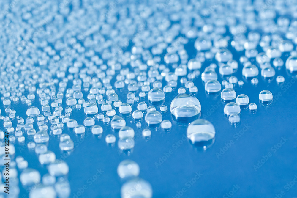 Water drops on blue glass Water drops on blue glass
