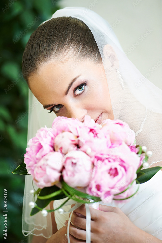 Happy bride with wedding bouquet