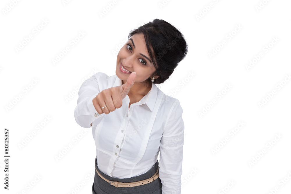 Beautiful Asian businesswoman gesturing a thumbs up Beautiful Asian businesswoman gesturing a thumbs up