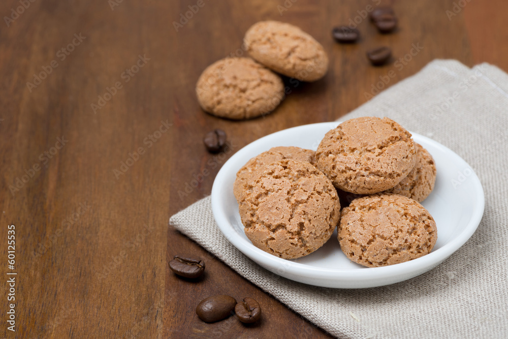 biscotti cookies and coffee beans on a wooden table