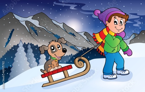 Boy with dog on sledge in winter