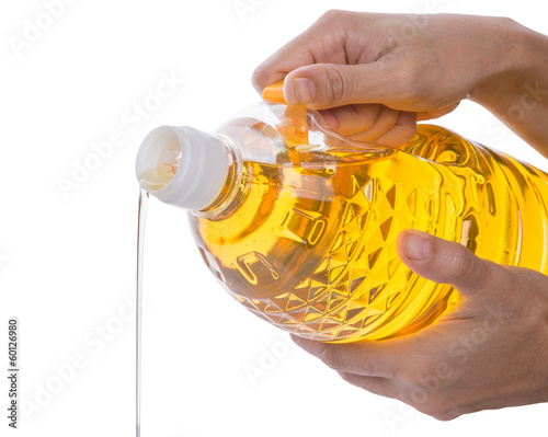 Female Hands Pouring Vegetable Oil
