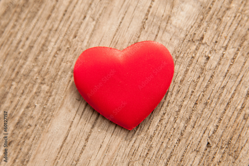 red heart over a wooden background red heart over a wooden background