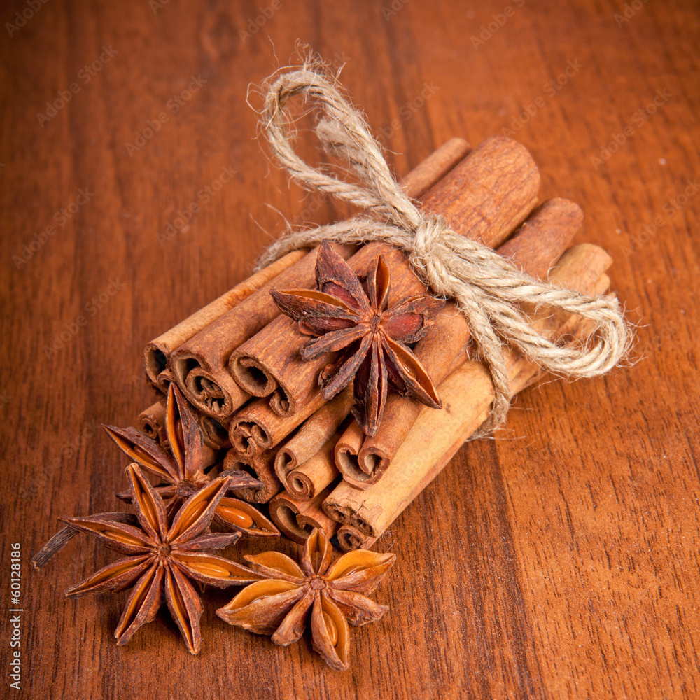 cinnamon sticks and star anise on a wooden background cinnamon sticks and star anise on a wooden background