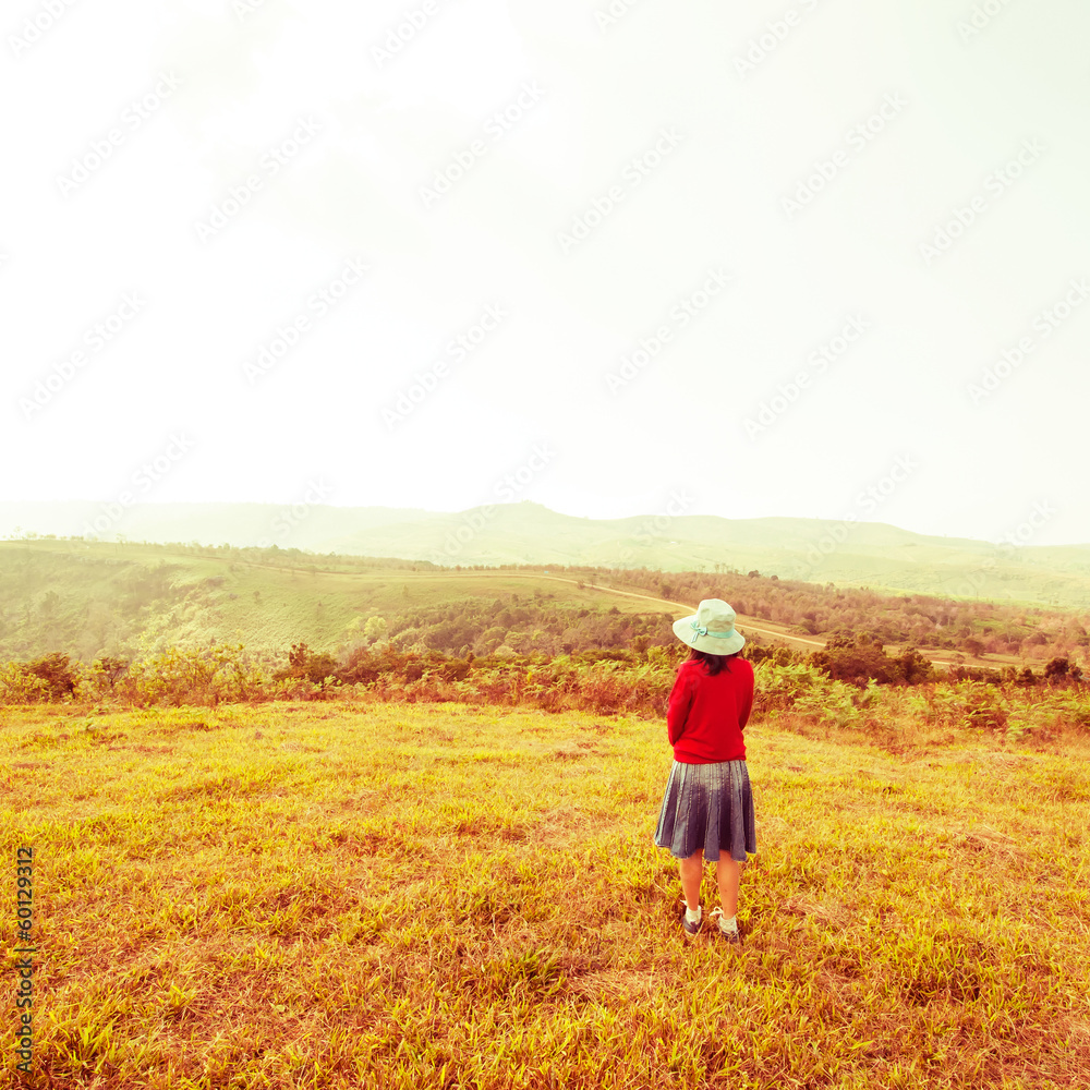 Vintage, Alone woman is standing with mountain views at countrys