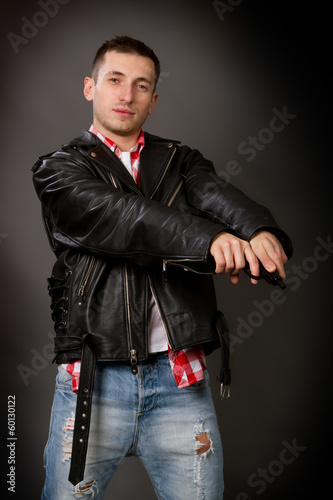 man in a leather jacket on a gray background