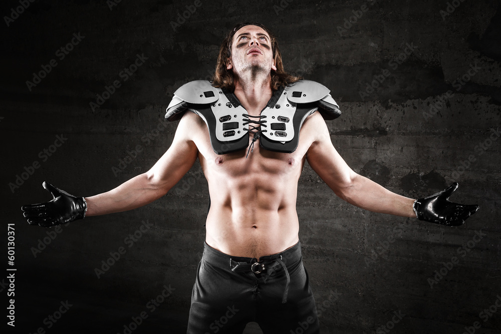 Bare chested american football player