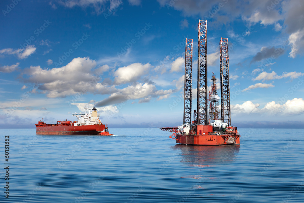 Oil rig and tanker ship on offshore area.