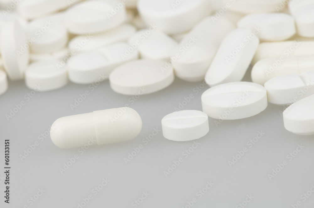 many white drugs pills shapes texture background many white drugs pills shapes texture background