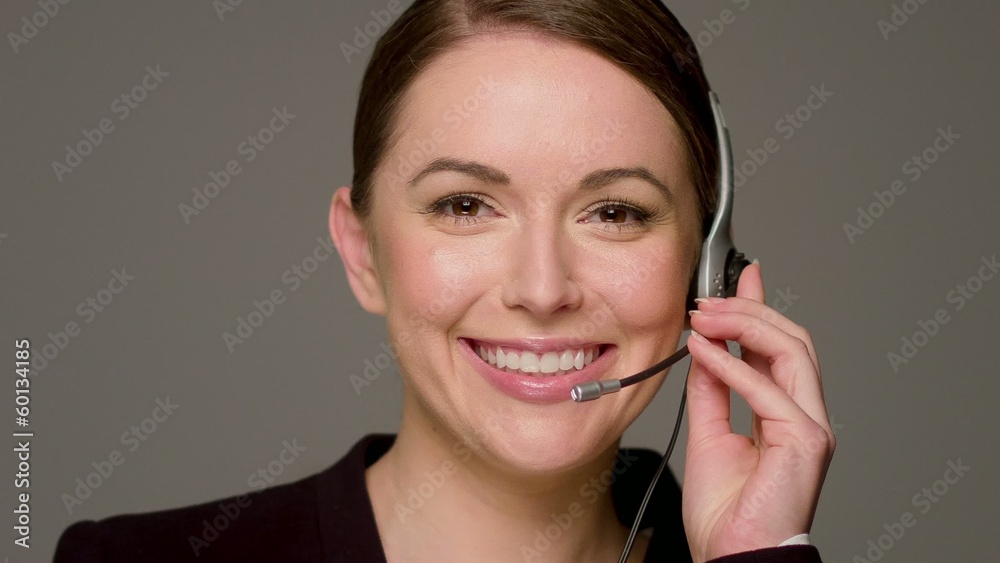 Beautiful Female Call Center Operator Talking And Smiling Beautiful Female Call Center Operator Talking And Smiling