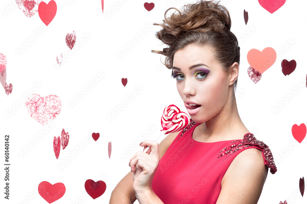 brunette woman holding lollipop brunette woman holding lollipop