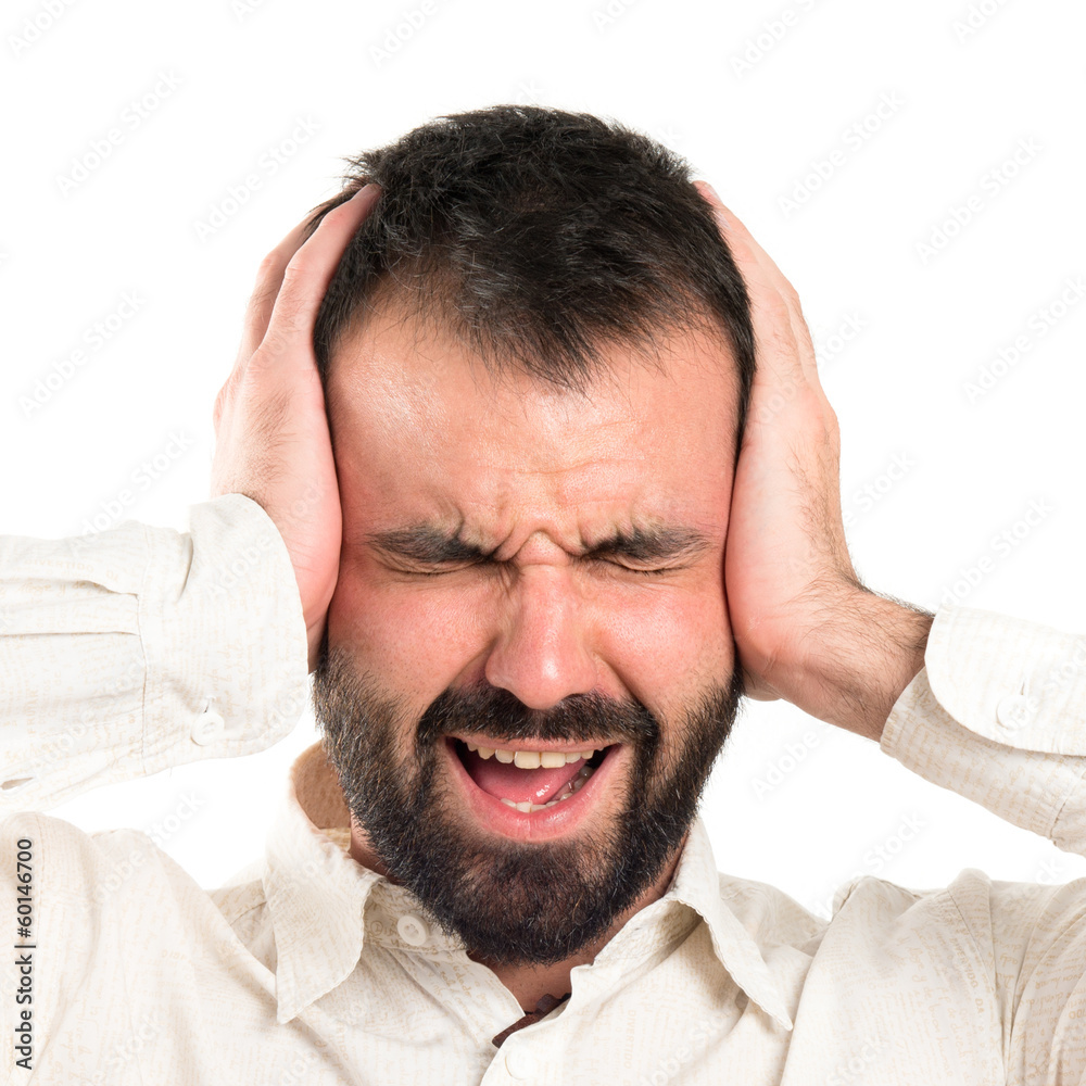 Young man with headache over white background Young man with headache over white background
