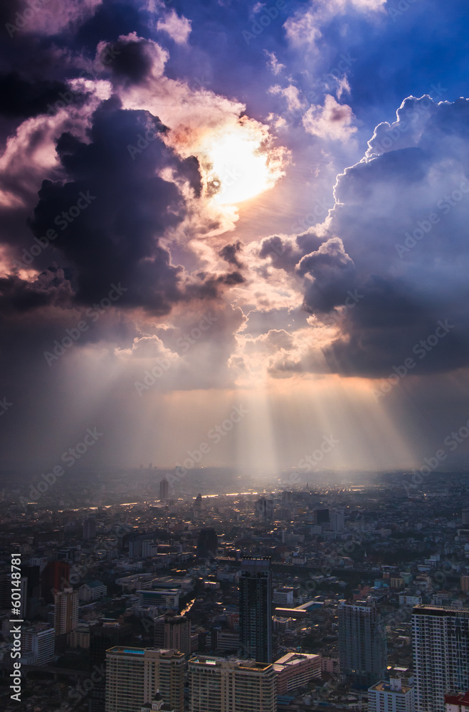 Rays of light shining through dark cloud