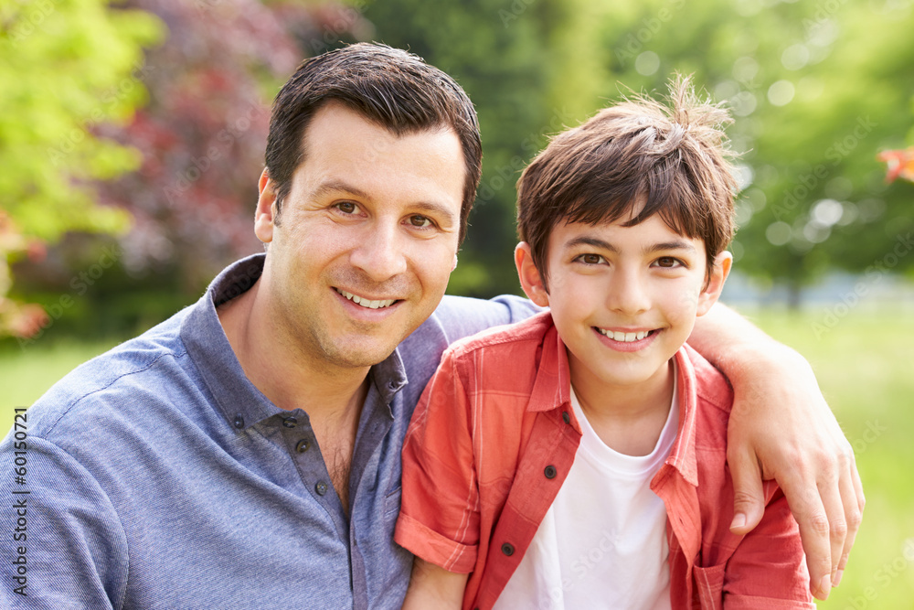 Portrait Of Hispanic Father And Son In Countryside Portrait Of Hispanic Father And Son In Countryside
