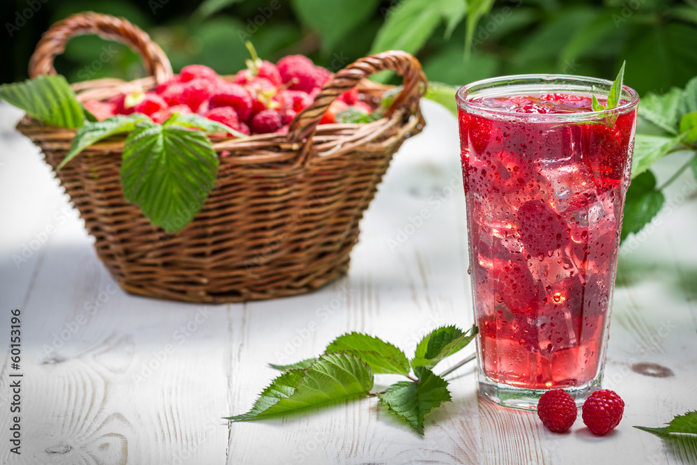 Juice from freshly harvested raspberries Juice from freshly harvested raspberries