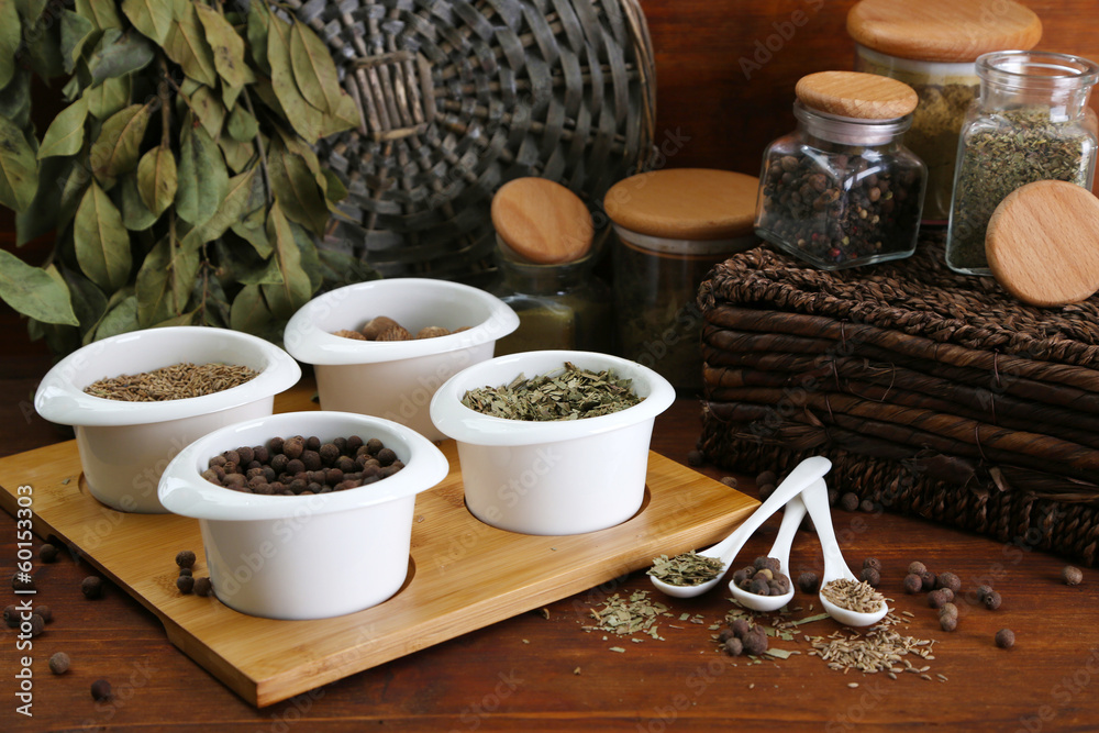 Assortment of spices in white spoons and bowls, Assortment of spices in white spoons and bowls,