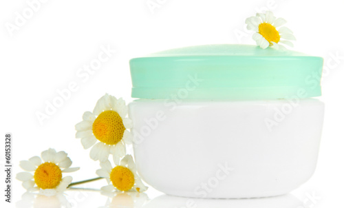 Cosmetic cream with wild camomiles  isolated on white