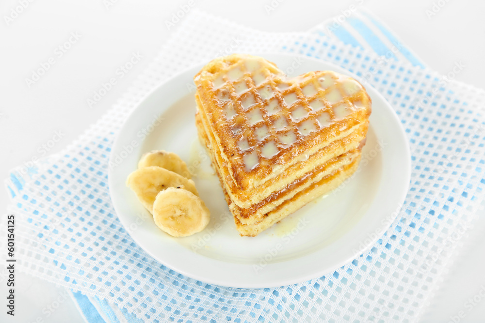Sweet Belgium waffles with banana, isolated on white Sweet Belgium waffles with banana, isolated on white