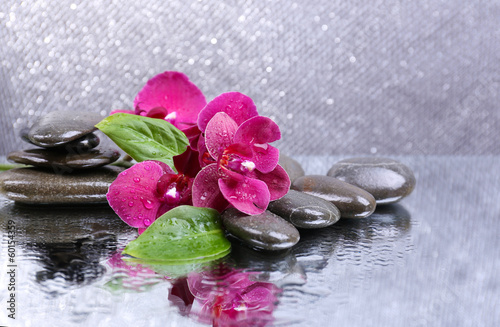 Fototapeta Naklejka Na Ścianę i Meble -  Composition with beautiful blooming orchid with water drops and