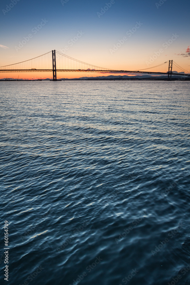 Sunset over river and bridges in Queensferry Sunset over river and bridges in Queensferry