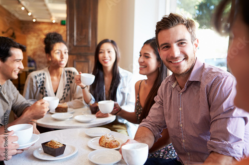 Group Of Friends Meeting In Café Restaurant