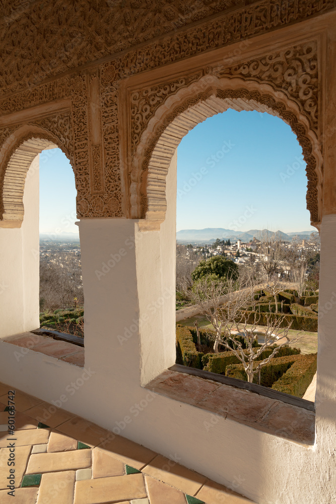 Arches of Generalife palace in Alhambra with garden view