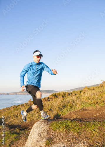 Man practicing trail running outdoors